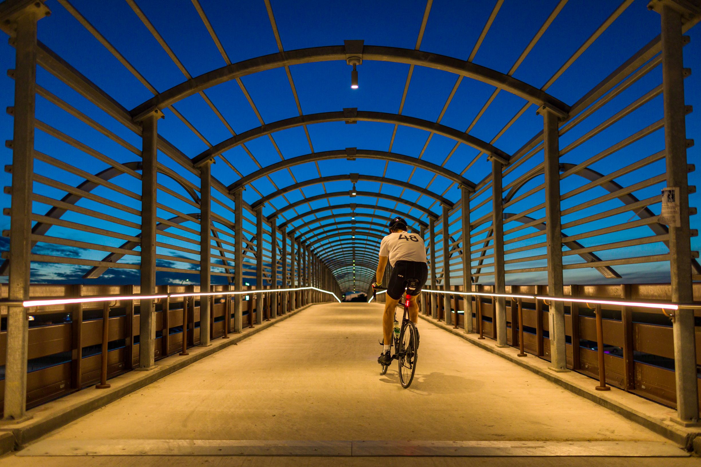 Cyclist on a 183 Trail Pedestrian Bridge